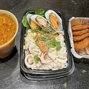Take-Out Thaitanium hot/sour seafood noodle soup and Tod Mun as they came out of the bag at home