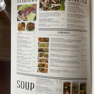 a hand holding a menu