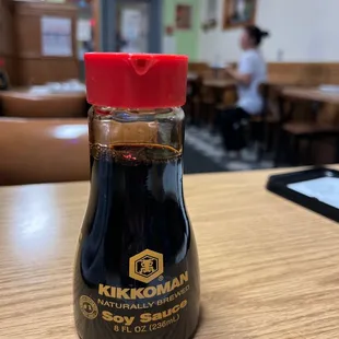 a bottle of sauce on a table