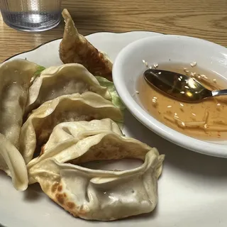 8E. Pot Stickers (6)