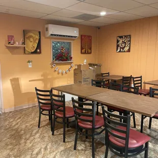 a dining room with tables and chairs