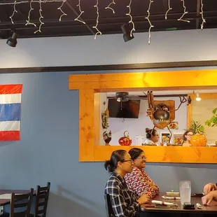 two people sitting at a table in a restaurant