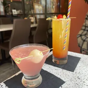 two cocktails on a table