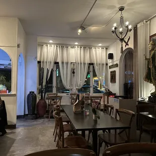 a restaurant with a long table and chairs