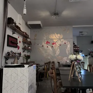 a dining area with tables and chairs