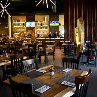 a dining area with tables and chairs