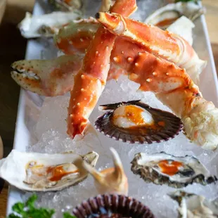 crab legs and oysters on a platter