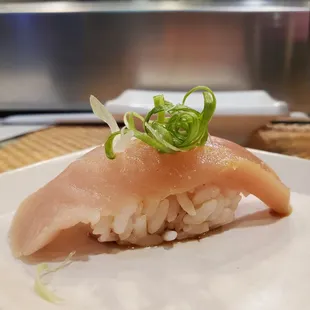 a piece of sushi on a plate