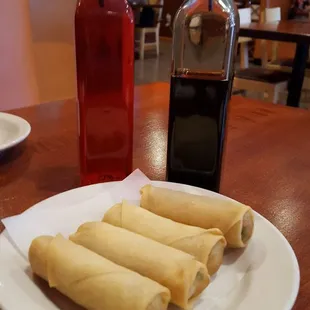 A2. Thai Crispy Spring Roll $3.70 Bottles of sweet and sour sauce and soy sauce.