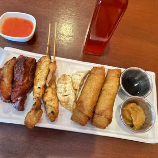 A11. Thai Orange Sampler a different view white coaster is Thai chili sauce.