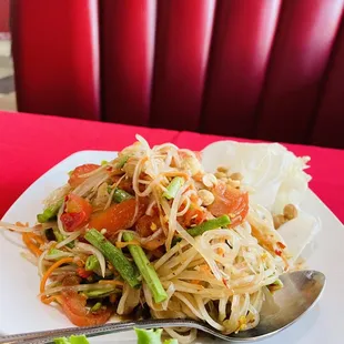 a plate of food on a red table