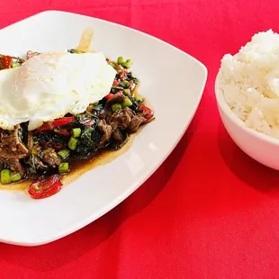 a bowl of rice and a plate of food