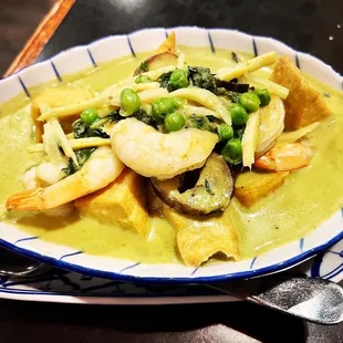 a plate of food with shrimp and vegetables