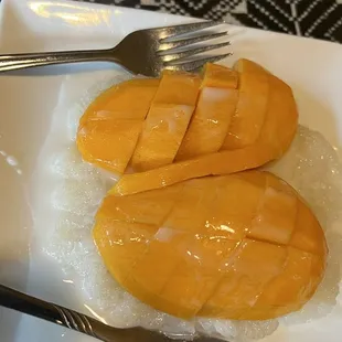 two slices of mango on rice