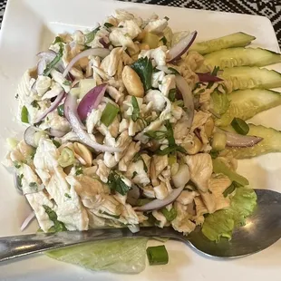 a white plate with a salad on it
