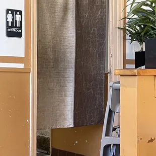 Dirty curtain leading to the bathroom!!