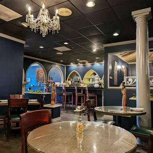 Inside the dining room, facing the bar and entrance area. This is one of a few different dining spaces they have in here. Spacious place.