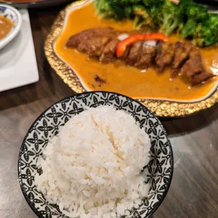 H3. Bangkok Duck. $20.95. Crispy deboned duck topped with panang curry paste and coconut milk with broccoli. Comes with bowl of rice.