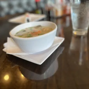 Coconut Soup Tom Kha- flavorful complete with tomatoes, gangal, chicken, and mushrooms