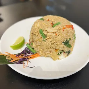 a fried rice dish on a white plate