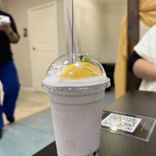 a smoothie in a plastic cup