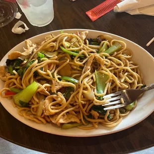 a plate of noodles and vegetables