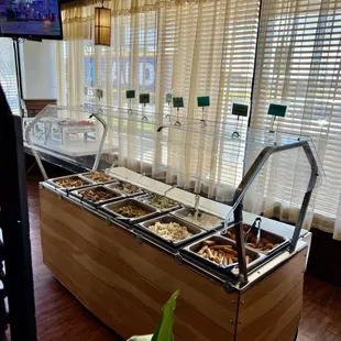 a buffet with a variety of food items