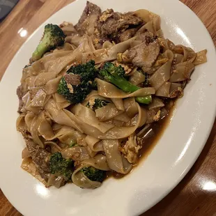 a plate of food on a wooden table