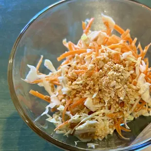 a bowl of shredded carrots and slaw