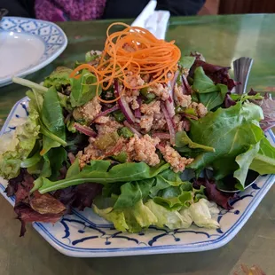 a plate of salad on a table