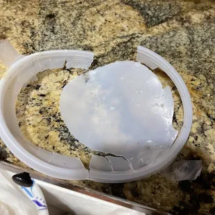 Broken lid from soup