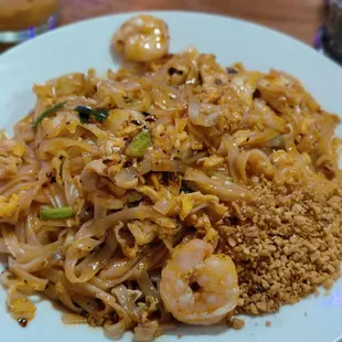 a plate of noodles and shrimp