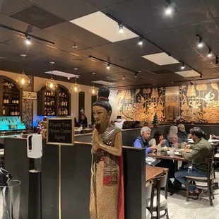 a statue of a woman at a restaurant