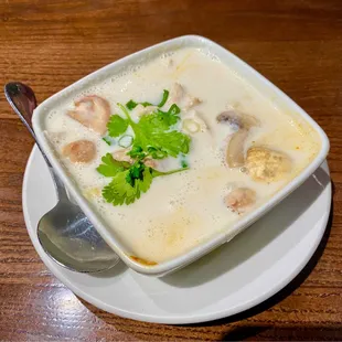 Tom Kha Gai - Chicken in Coconut Soup, Mushroom, Scallion, Cilantro, Lime, Scent of Thai Herbs