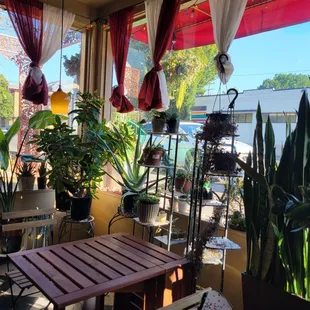 a patio with a table and chairs
