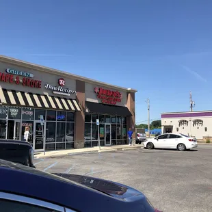 Exterior, this side of the strip mall faces Thompson
