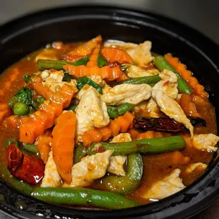 a bowl of chicken and vegetables