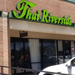 Store front located in the middle of a strip mall.