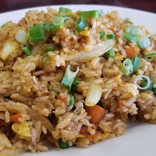 Sriracha Fried Rice with Chicken  Eggs, tomatoes, peas, carrots, onions, Sriracha sauce.