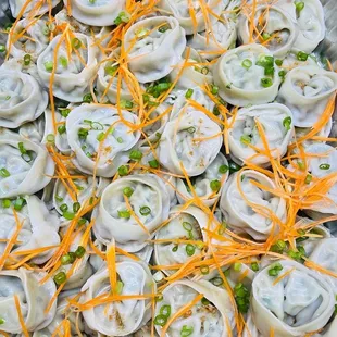 a tray of steamed dumplings