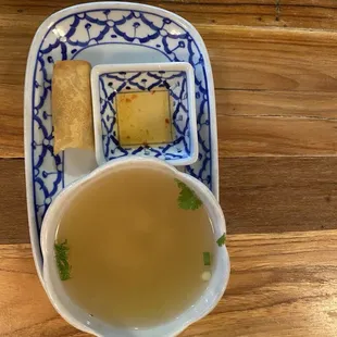 The spring roll with sauce and a small bowl of soup preceded the main course