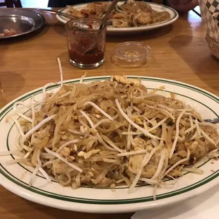 a plate of pad thai noodles