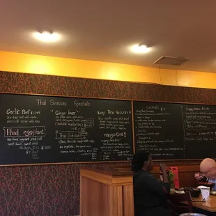 a menu on a blackboard in a restaurant