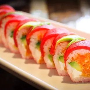 a sushi roll on a white plate