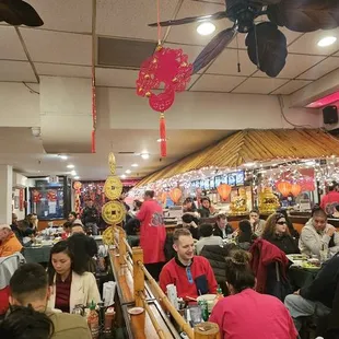 a large group of people in a restaurant