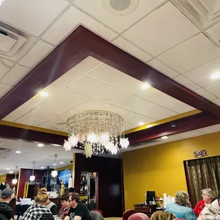 people sitting at tables in a restaurant
