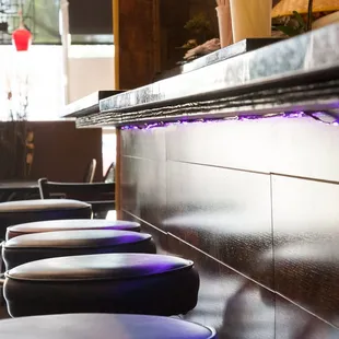 a row of stools in a restaurant