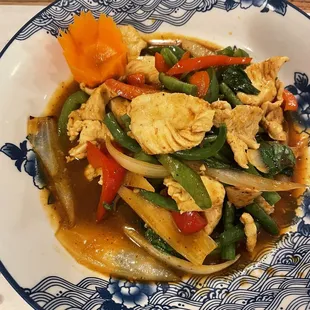 a plate of chicken and vegetables