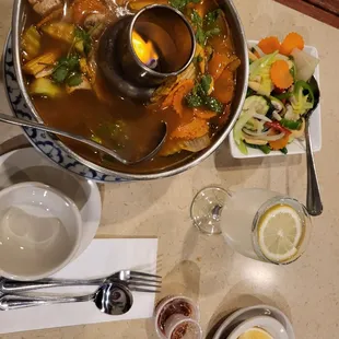 a bowl of soup and a plate of vegetables