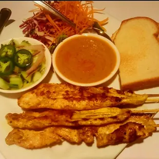 Chicken Satay with peanut sauce and delicious Cucumber, onion, jalapeno relish.